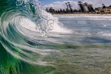 A wave breaks at the sea
