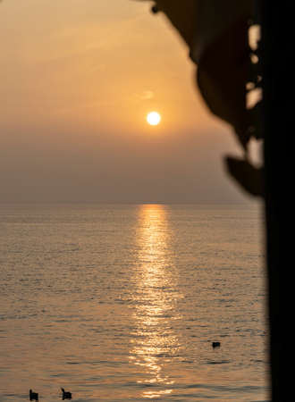 sun set at lake in italyの写真素材