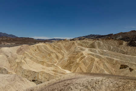 yellow rock waves in death valleyの写真素材