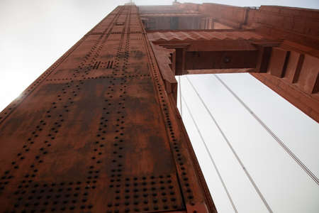 red pillar of golden gate bridge from the bottomの写真素材