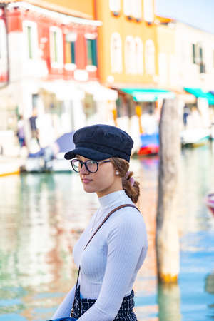 fashion girl in front of a canal in venice muranoの写真素材