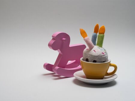 wooden pink horse rocker on white backgroundの写真素材