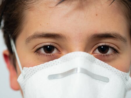 CHILD WITH MASK AND LOOK FORWARDの写真素材