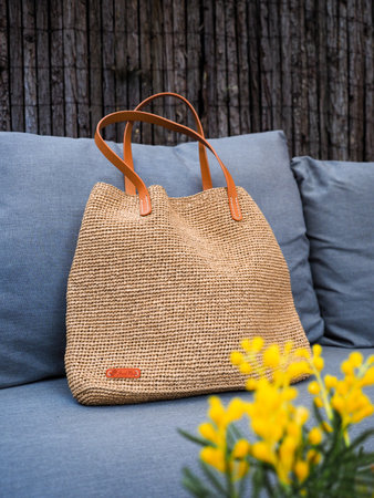 crochet handbag, handmade, with a small sign indicating it.の写真素材