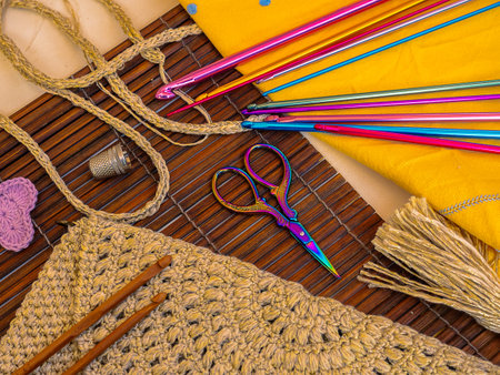 colorful utensils on a wooden background, for hand crochetingの写真素材