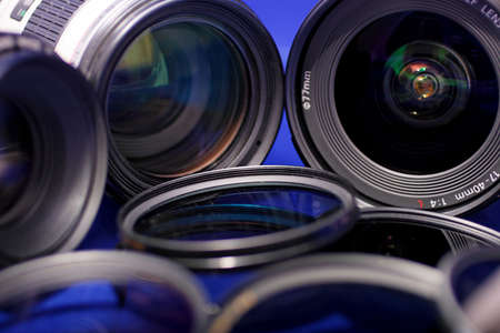 lenses and photo filters on blue background