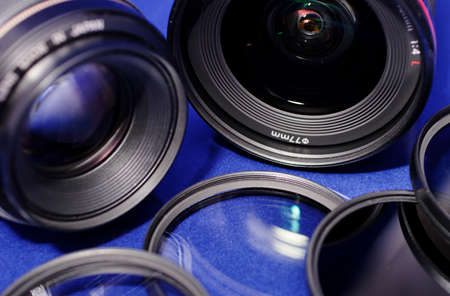lenses and photo filters on blue backgroundの写真素材
