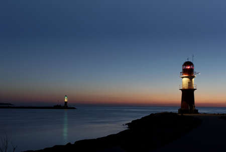 Two lighthouses after sunset long tim exposureの写真素材