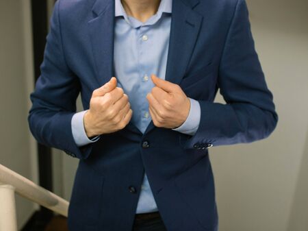 Business man on stairway wearing blue blazer jacket ready for appointmentの写真素材