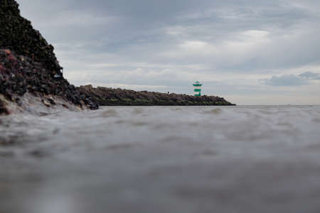Harbor entrance in Scheveningen shot from the waterの写真素材