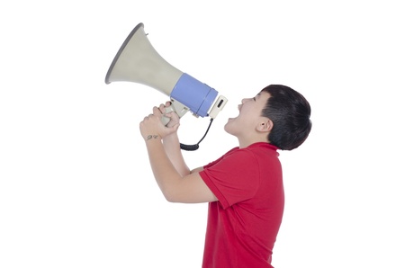 Student shouting through megaphone with white backgroundの写真素材
