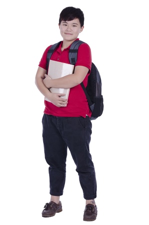 Smiling teenager with a schoolbag standing with white backgroundの写真素材