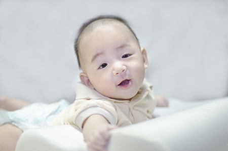 Cute infant smilingの写真素材