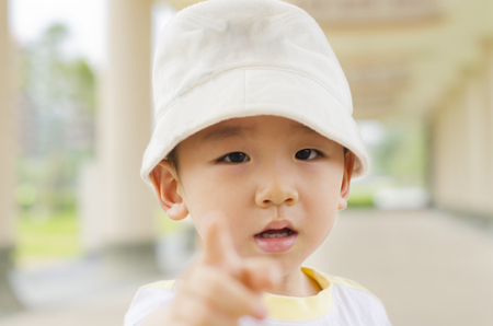 Kid pointing finger hand forwardの写真素材