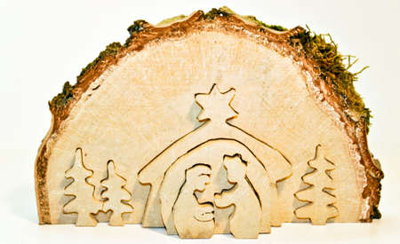 Cut out of  birch tree slice showing christmas nativity: Mary, Joseph, baby Jesusの写真素材