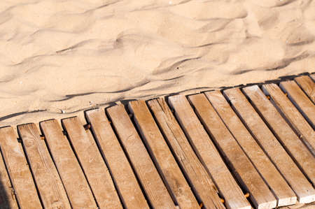 Weathered wooden boardwalk on sand on Crete Island in Greeceの写真素材