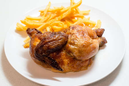 Chicken roasted with friesの写真素材
