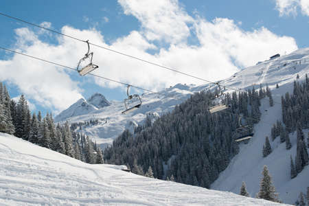 Skilift in a skiing resort in the Alpes in a valley of Montafonの写真素材