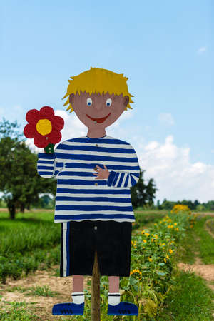 Handcrafted boy symbol promoting a field to pick your own flowersの写真素材