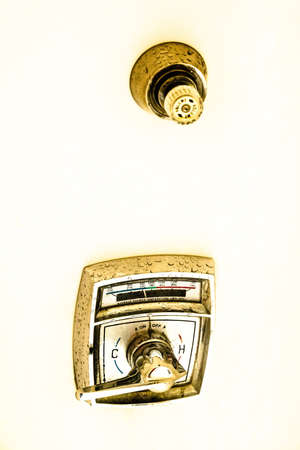 Vintage American shower faucet cold and hot water in the bathroomの写真素材