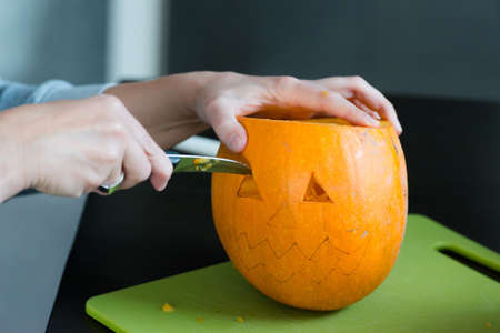 Halloween pumpkins Jack O'Lantern being carved for Halloweenの写真素材