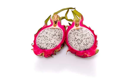 Two halves of pitahaya or dragon fruit with shadow and reflection on white backgroundの写真素材