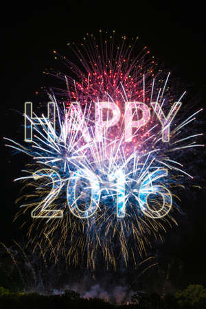 Happy New Year 2016 with colorful sparklers. The words Happy 2016 are integrated into the fireworks with black backgroundの写真素材