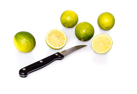 Knife and green fresh limesの写真素材