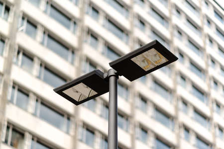 Modern streetlamp and concrete buildingの写真素材