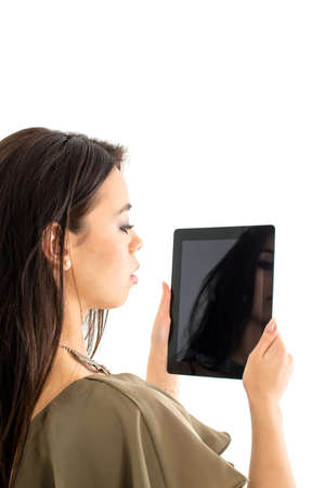 Attractive woman using a tablet computerの写真素材