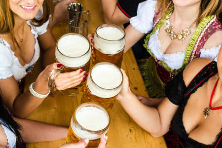 Bavarian girls drinking beerの写真素材