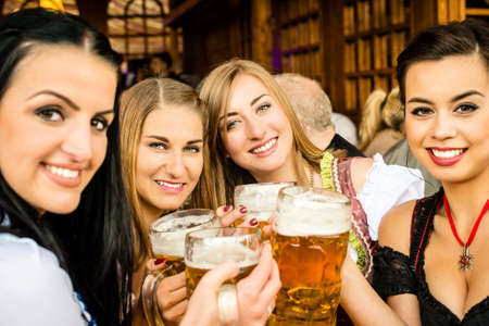 Girls drinking beerの写真素材