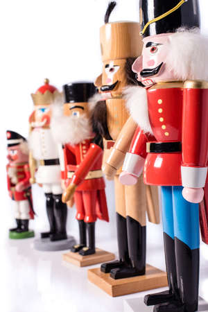 Row of five antique nutcrackers - studio shot on white background with shallow dof and great reflectionsの写真素材