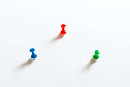 Thumbtack pins on whiteの写真素材