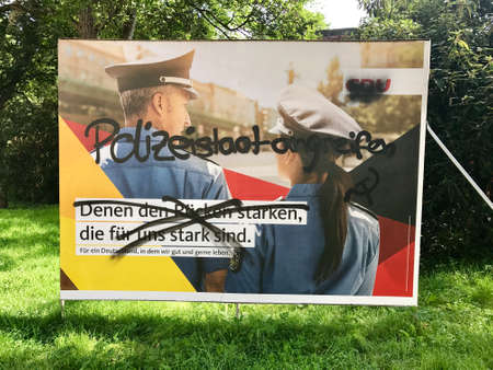 Vandalized CDU billboard for the German Parliamentary Electionsのeditorial素材