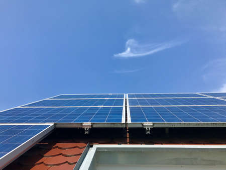 House roof with solar panels on topの写真素材