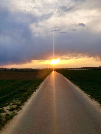 Sunset light above asphalt roadの写真素材