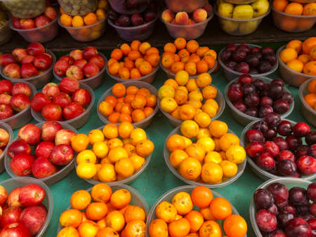 Fruit market with various colorful fresh fruits and vegetables