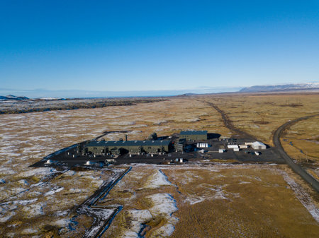 Aerial of industrial facility capturing carbon in the snowy volcanic landscape of Hellisheidi, Iceland highlights cutting edge technology aimed at promoting sustainability and environmental preservationの写真素材