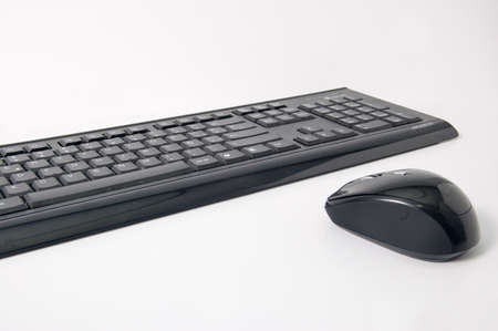Black keyboard and mouse with white backgroundの写真素材