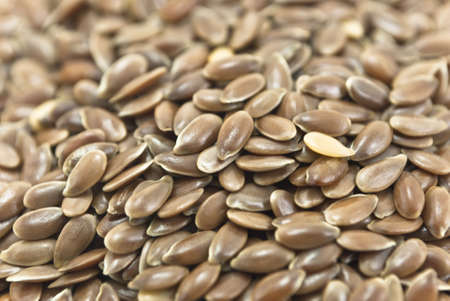 Closeup of a pile of linseeds (aka flaxseeds) filling whole frame.の写真素材
