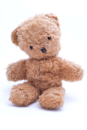 Old teddy bear from the early 1960's.  Reddish brown with black eyes and a stitched nose. の写真素材