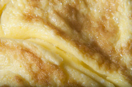 Macro (close up) shot of a freshly cooked omelette.  の写真素材