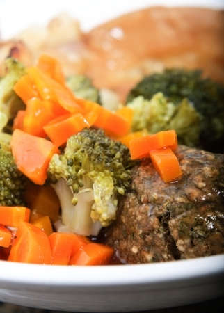 A meatless Sunday roast with vegetarian gravy.  Vertical (portrait) orientation.の写真素材