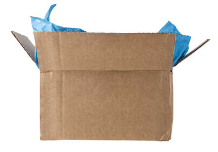 An opened cardboard box with light blue packing tissue exposed, photographed at eye level and isolated on a white background.の写真素材