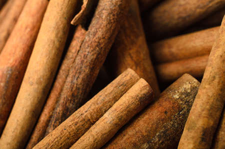 Close of a large pile of Cinnamon sticks, filling frame.  Shallow depth of field.の写真素材