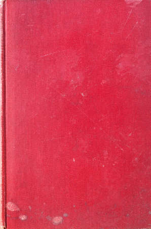 Texture background of an old, worn and marked red fabric woven book cover.の写真素材