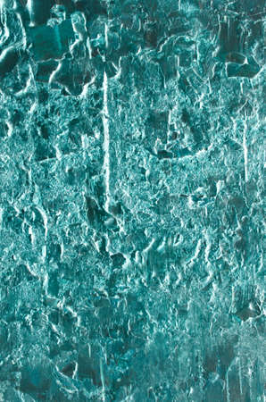Organic wood texture with icy, glacial abstract appearance, tinted turquoise.の写真素材
