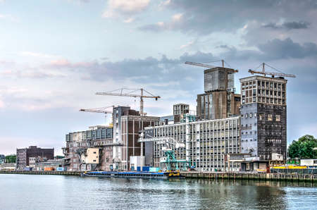 Rotterdam, The Netherlands, July 16, 2018: the grain silo in Katendrecht is still in use while the area around it transforms into a popular urban neighbourhoodのeditorial素材