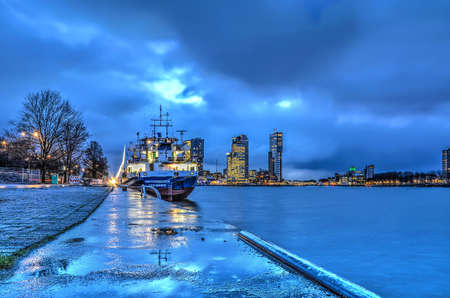 Rotterdam, The Netherlands, January 12, 2016: View along Park Quay (Parkkade) towards Wilhelminapier under a cloudy sky before sunriseのeditorial素材